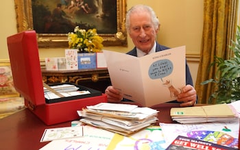 King Charles has released videos of himself opening cards from well wishers